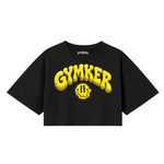 Crop top negro GYMKER Yellow Smile con letras y carita sonriente amarillas en el frente.