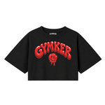 Crop top negro GYMKER Red Smile con letras y carita sonriente rojas en el frente.