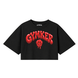 Crop top negro GYMKER Red Smile con letras y carita sonriente rojas en el frente.