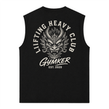 Tank Top Oversize GYMKER Lifting Heavy Club Dragón negra: espalda con cabeza de dragón, texto LIFTING HEAVY CLUB y firma GYMKER EST. 2020